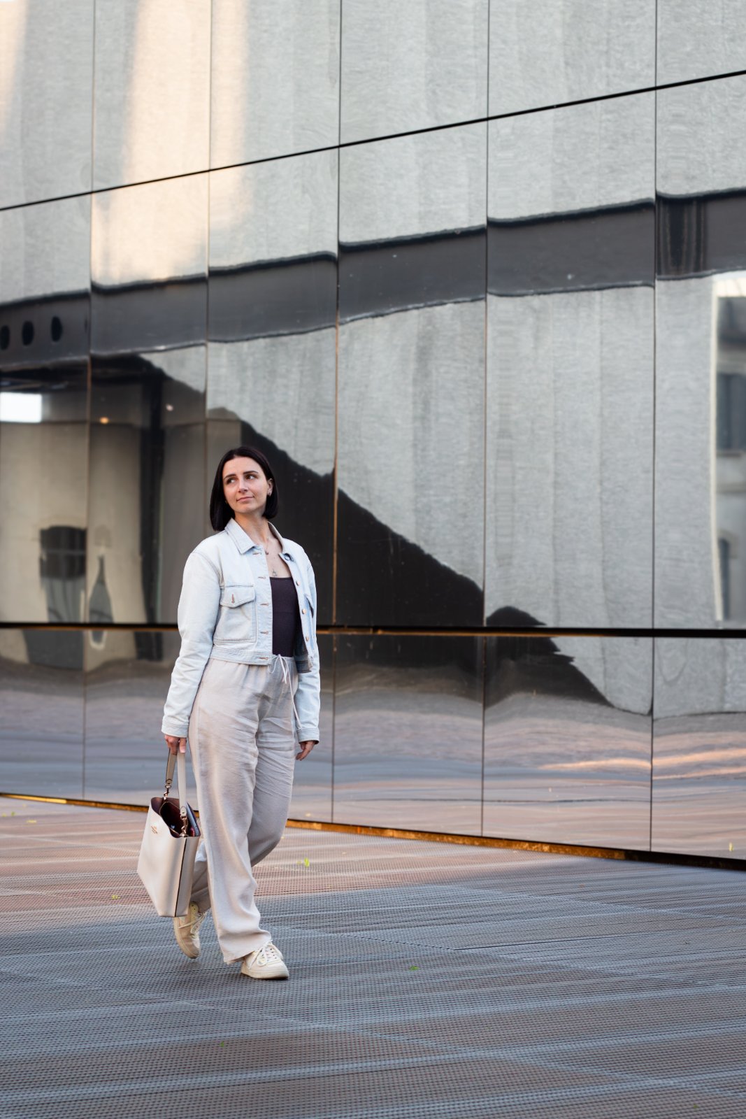 Portrait against a mirrored facade