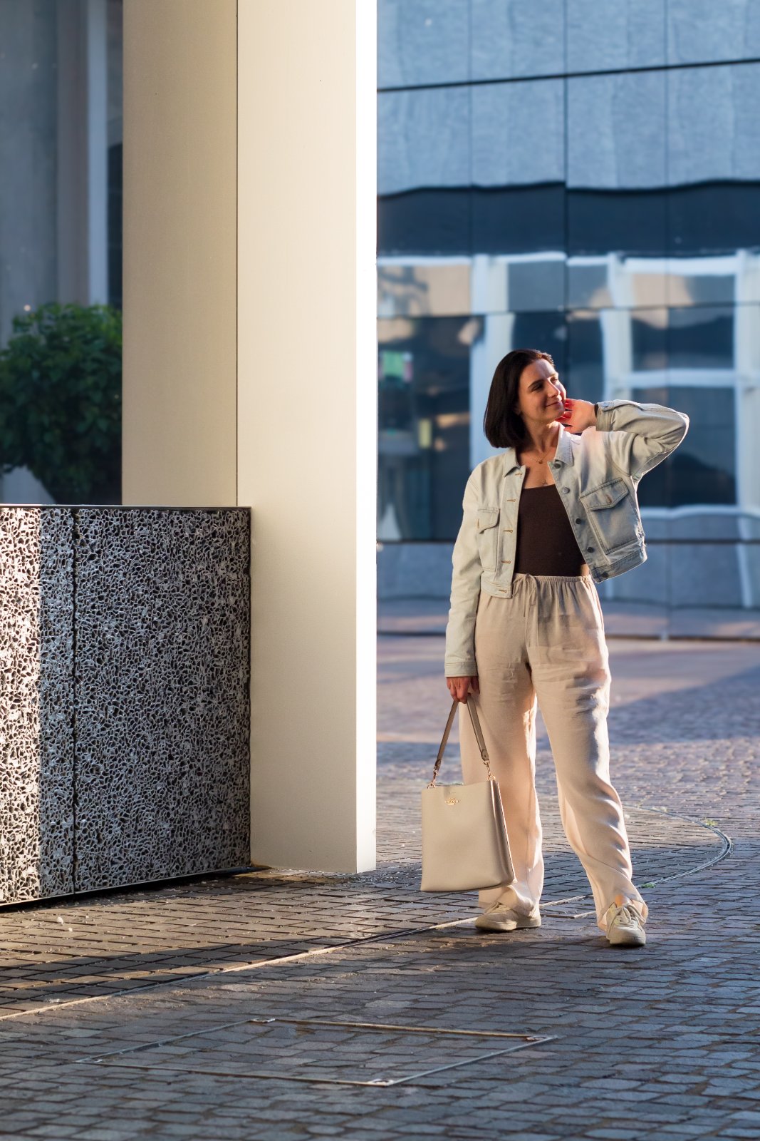 Golden-hour portrait by a stone column