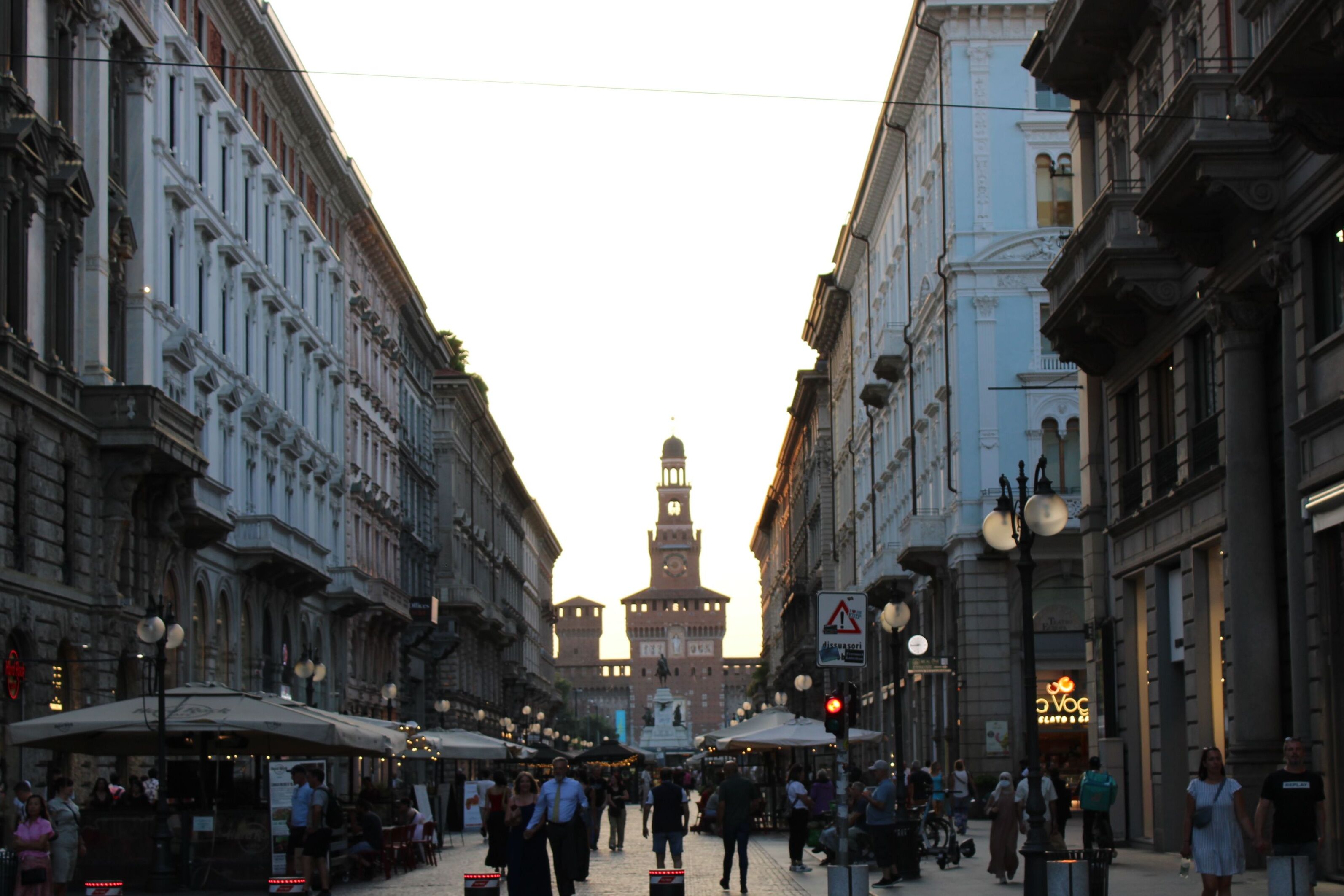 A Milan street at dusk, leading to Castello Sforzesco